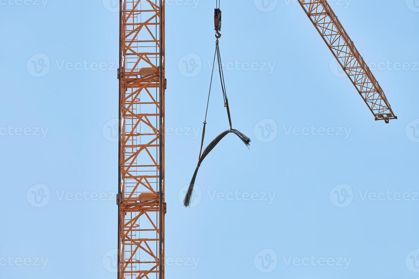Construction crane working on building complex photo