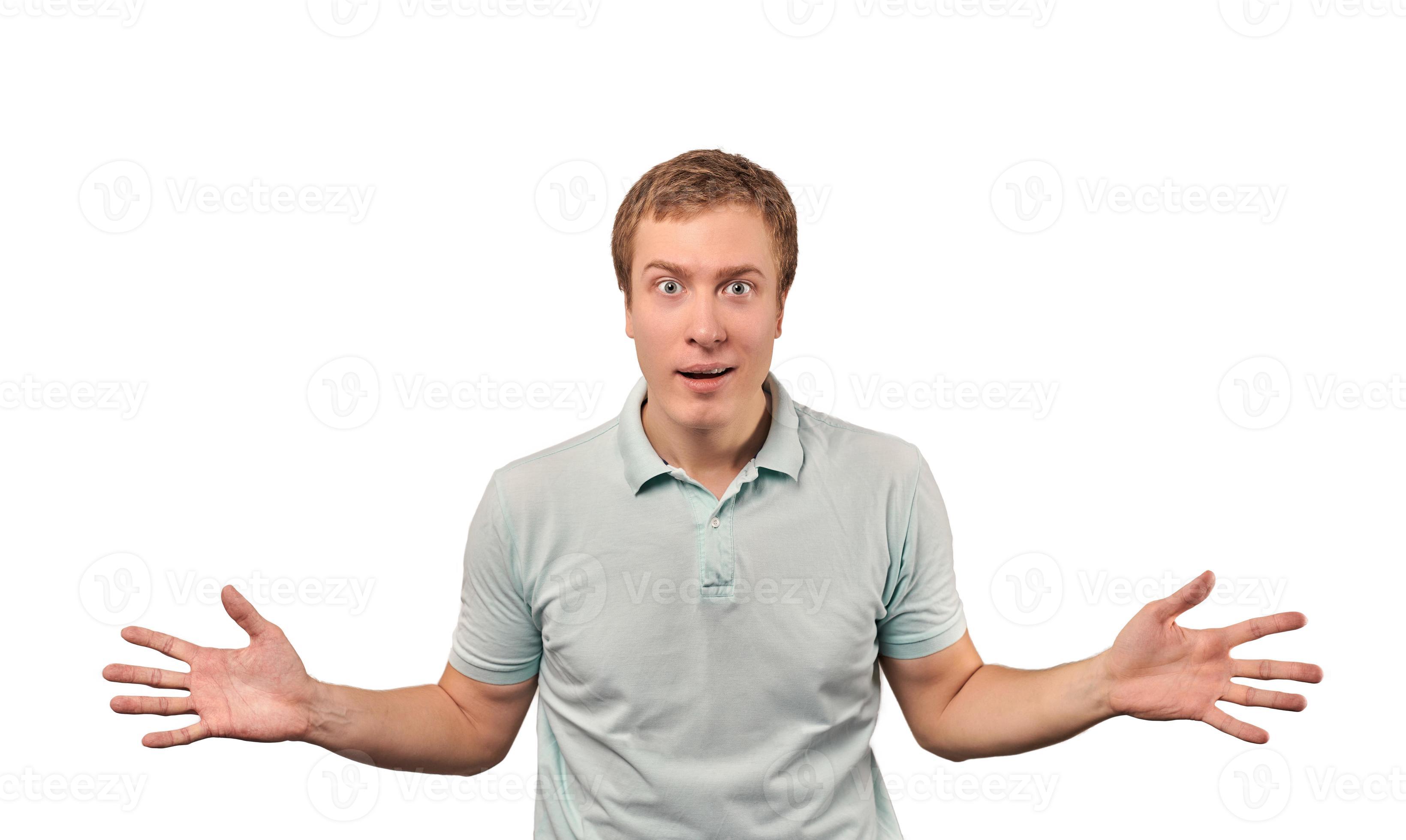 Confused young man shrugged shoulders guy in casual T shirt spread arms isolated white Confused young man shrugged shoulders guy in casual T shirt spread arms isolated white