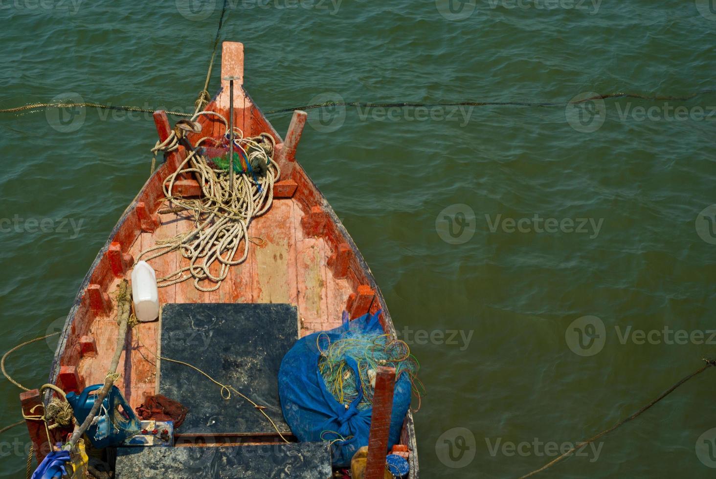 Wooden fishing boat coastal drift after returning from fishing photo