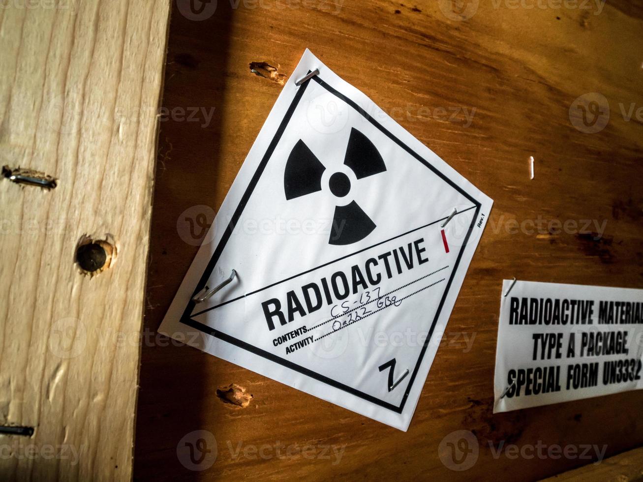 Radiation label beside the transport wooden box Type A package photo