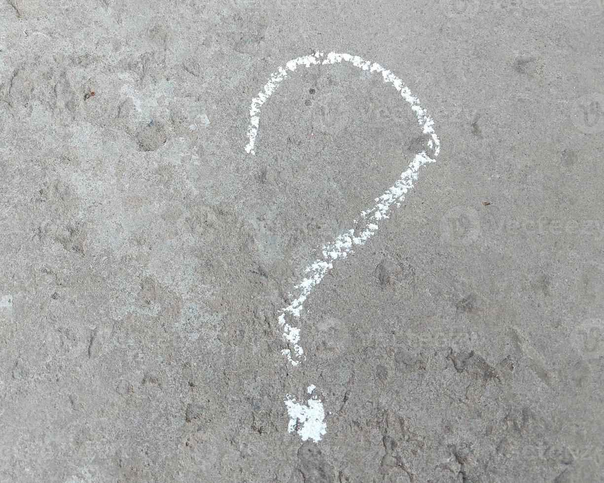 question mark is drawn in chalk on the pavement. problem concept. photo