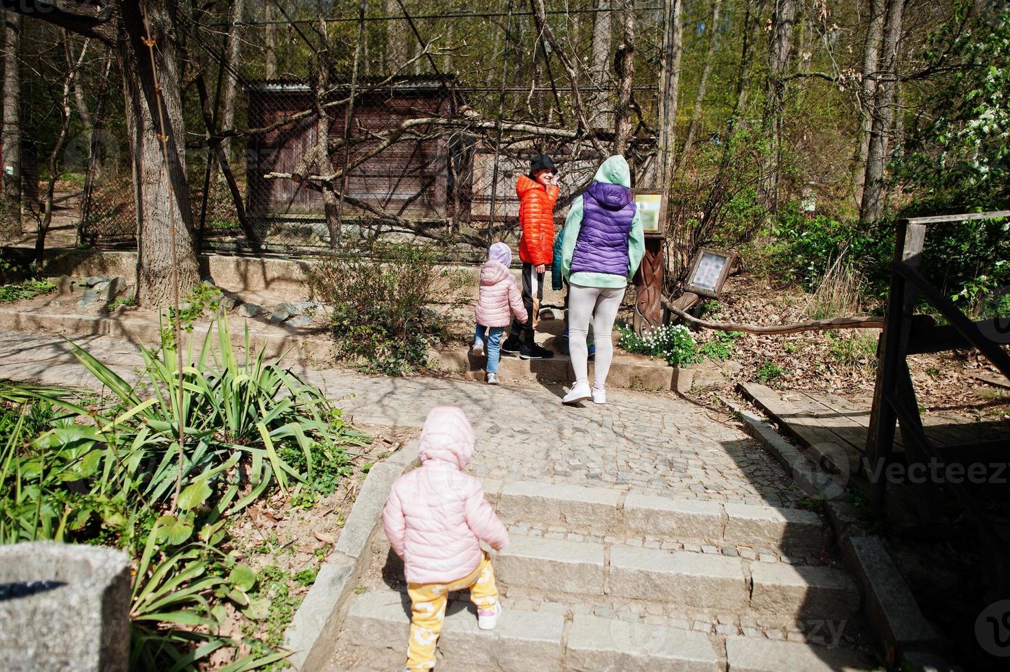 Mother with kids at bird zoo. photo