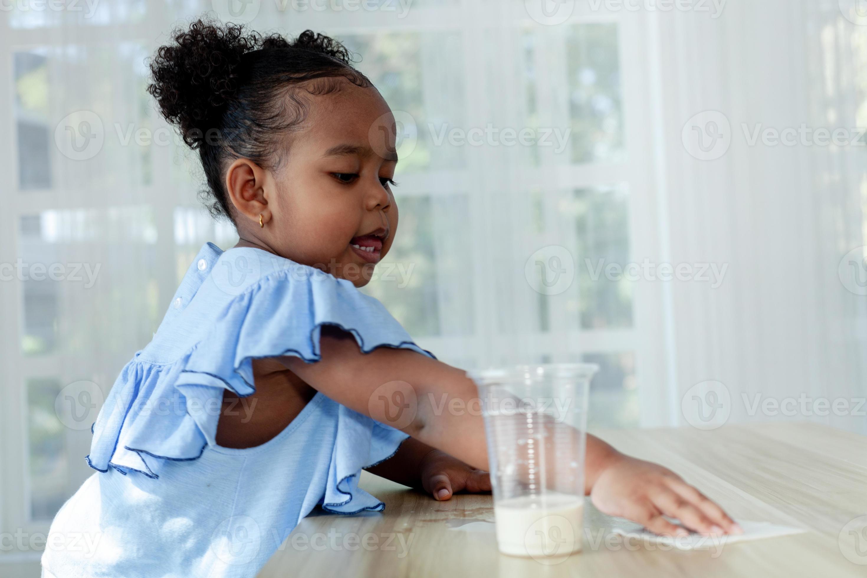 Close up Shot Cute Black Girl Having Fun Cleaning The Dining Table luckley-joins-robins