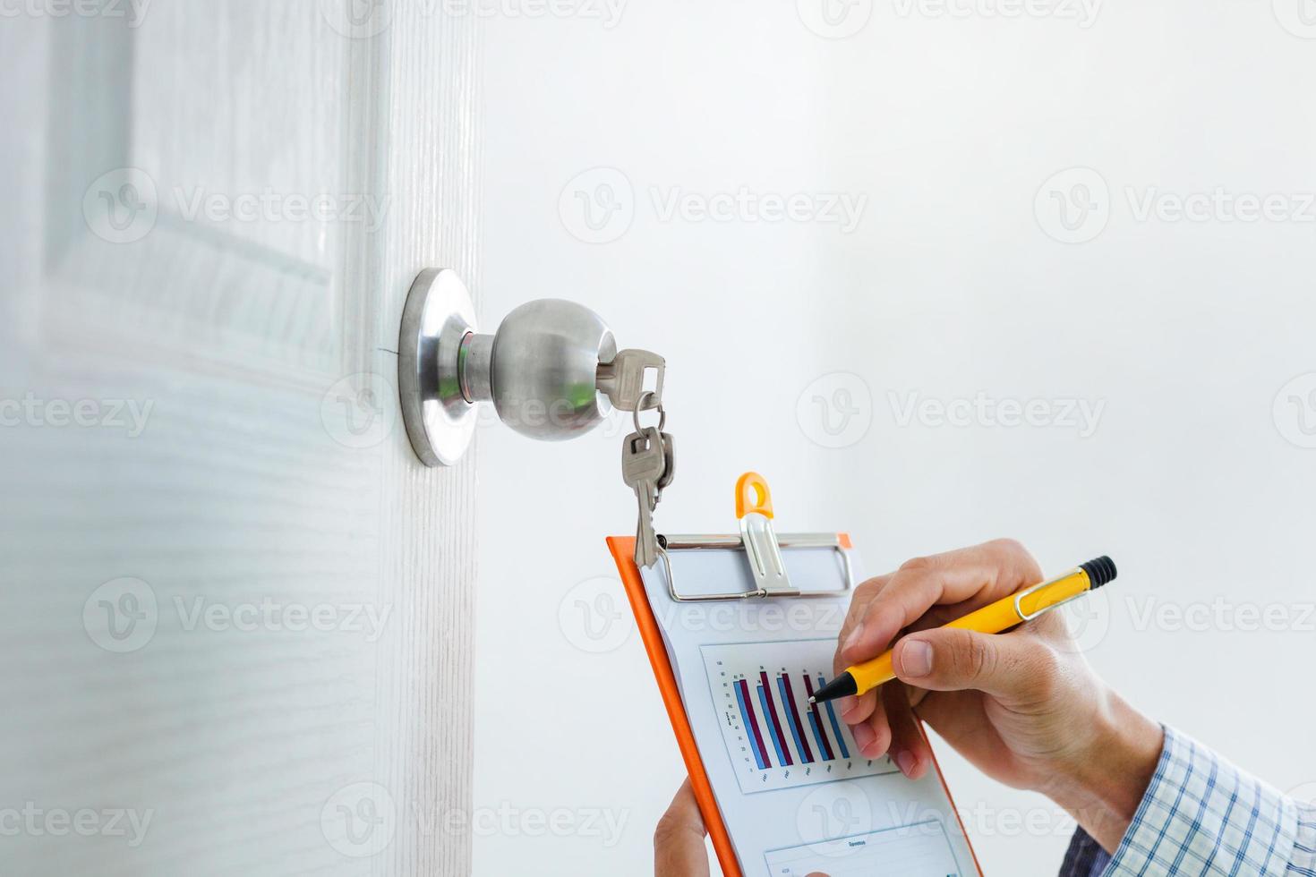 Close-up view Young engineers or architects are happy to work checking documents for the construction of a residential building. Real Estate Design and Construction Concepts photo