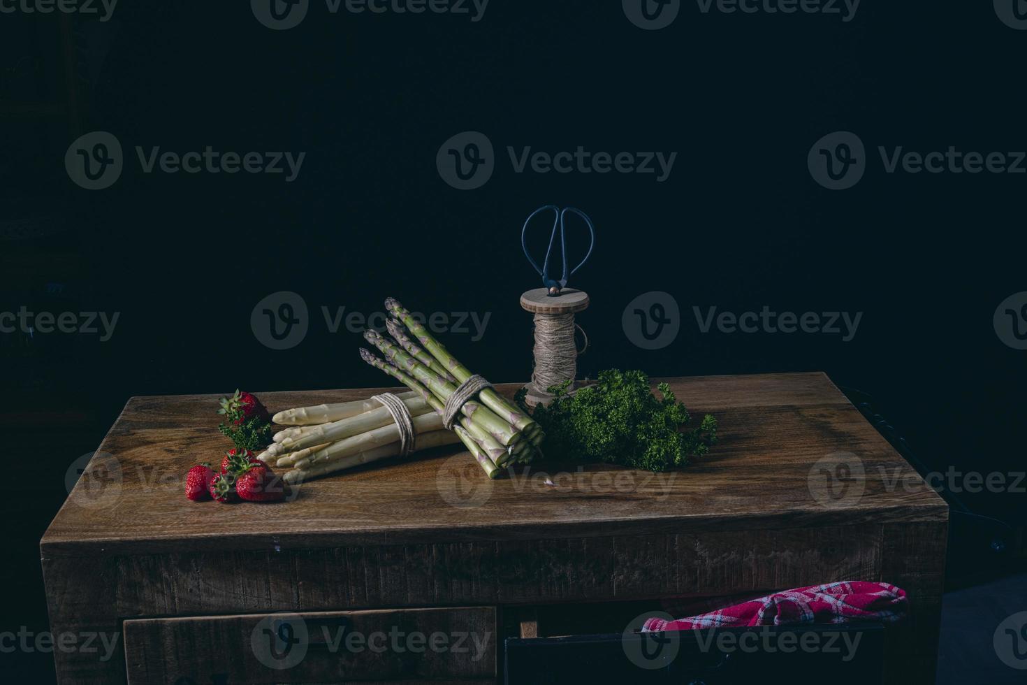 Green and white asparagus on the table photo