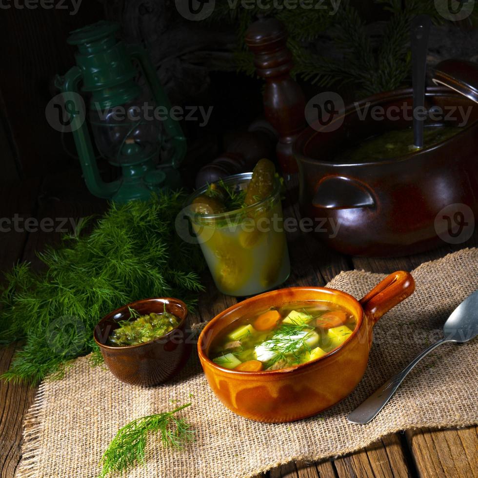Polish sour cucumber soup with dill photo