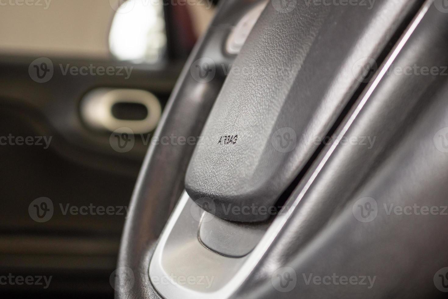 Safety airbag sign on car steering wheel photo