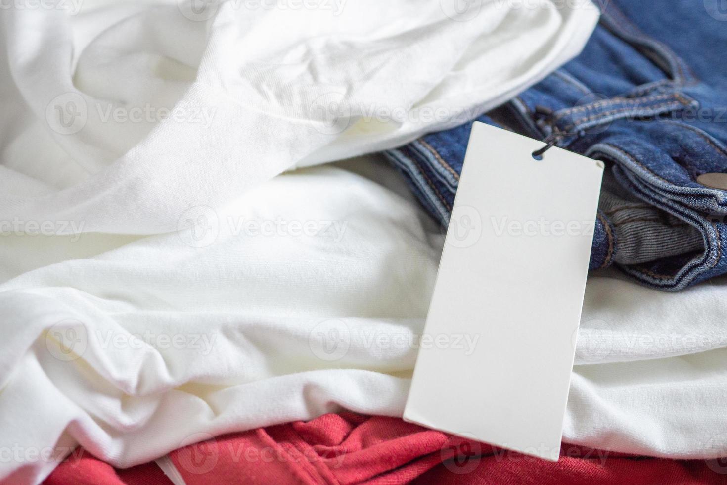 Blank price tag label on white t-shirt photo