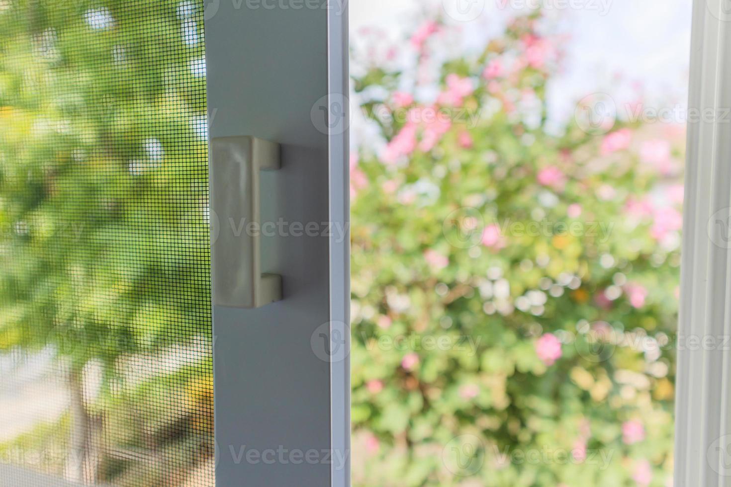 mosquito net wire screen on house window protection against insect photo