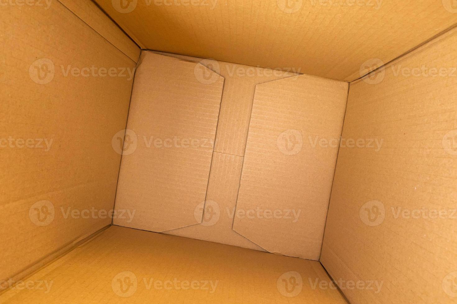 Open empty brown cardboard box background top view photo