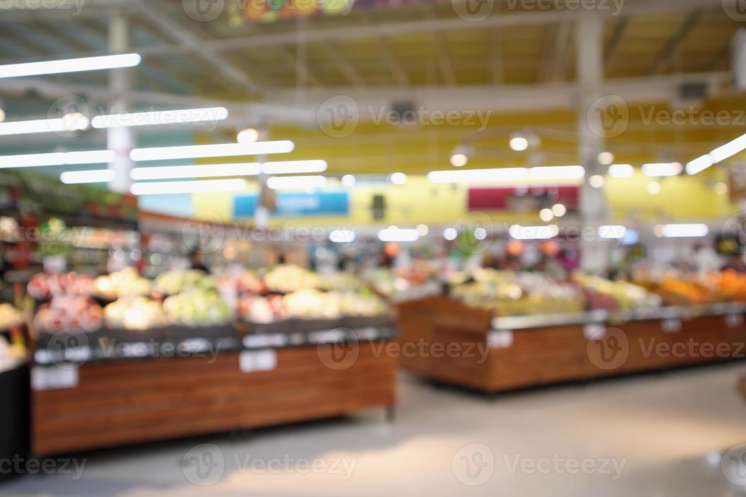 abstract blur organic fresh fruits and vegetable on grocery shelves in supermarket store defocused bokeh light background photo
