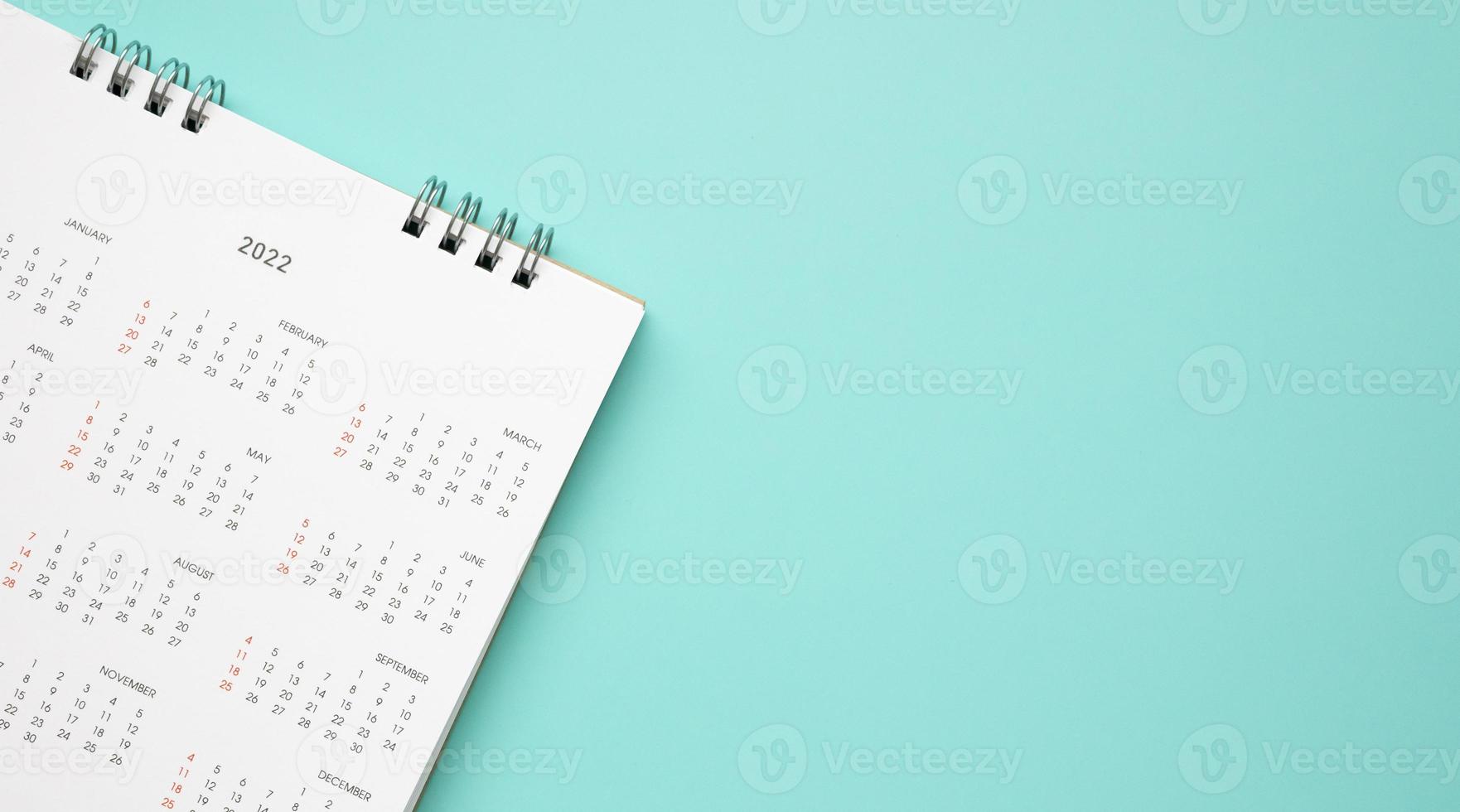 2022 calendar page on blue background business planning appointment meeting concept photo