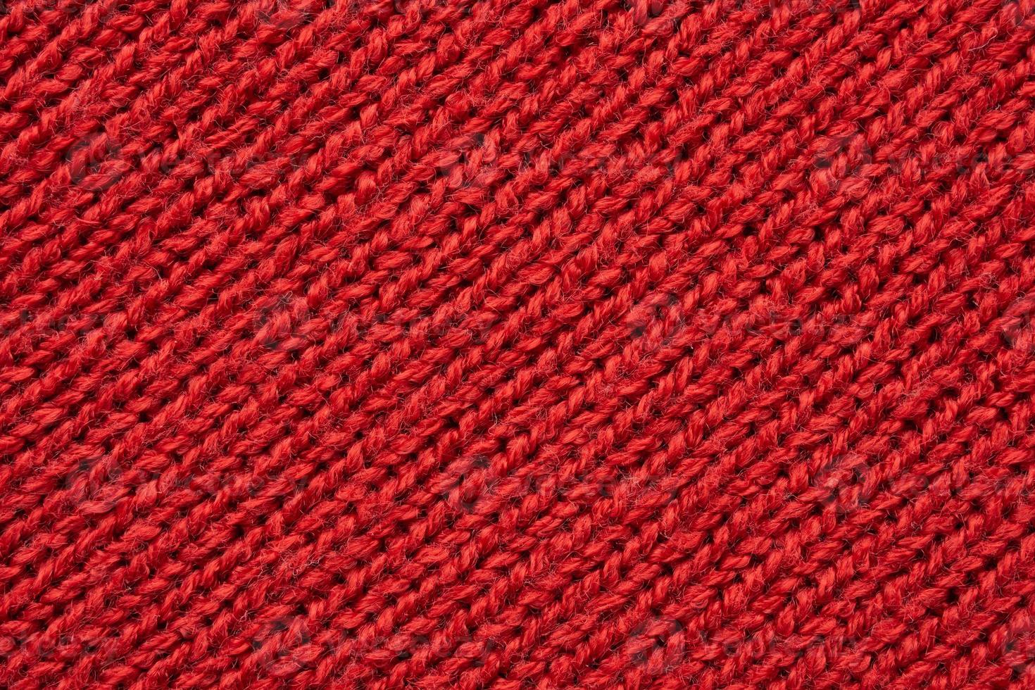 Red knitted cloth wool texture surface background photo