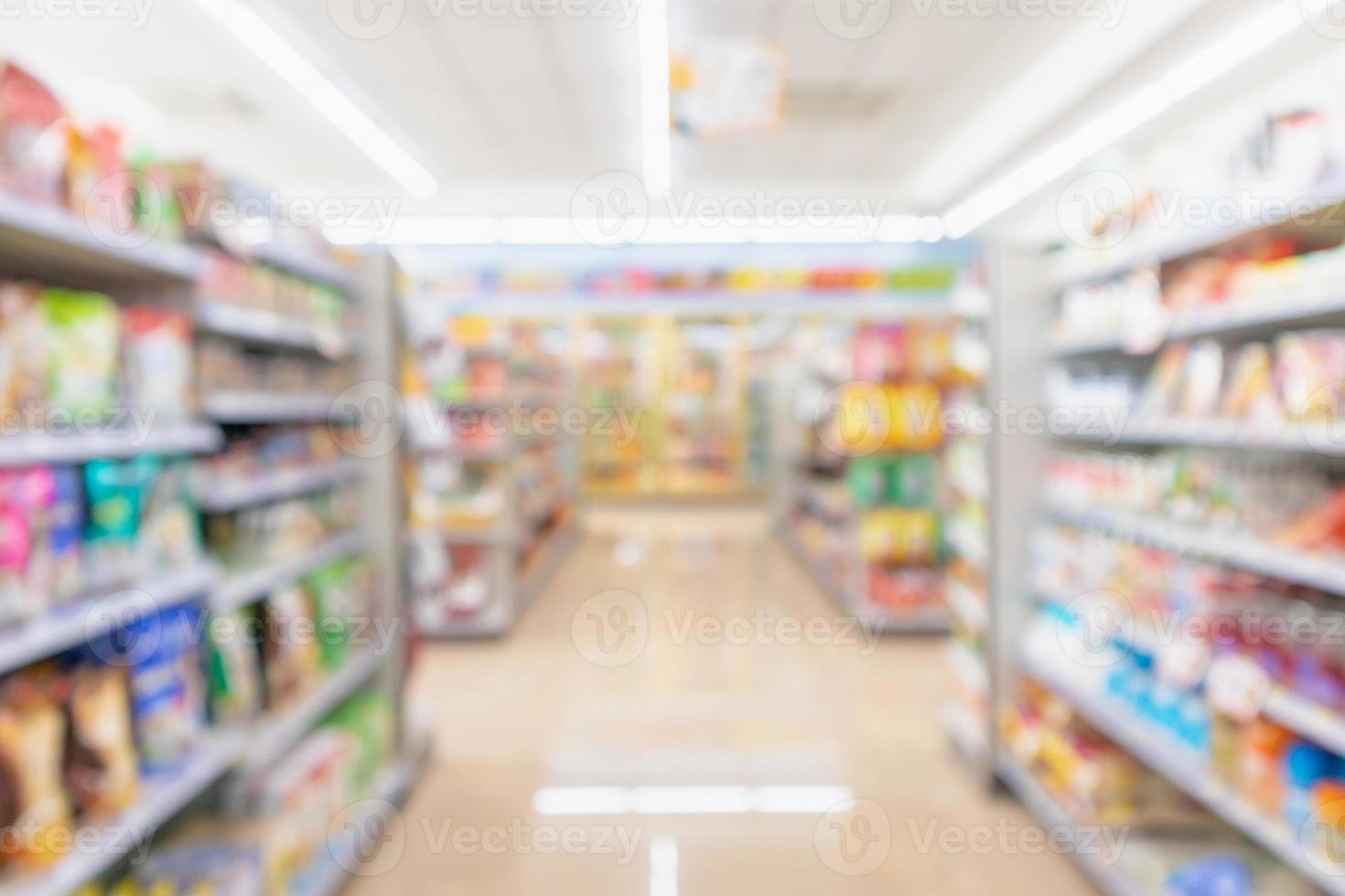 Supermarket aisle interior shelves blur background photo