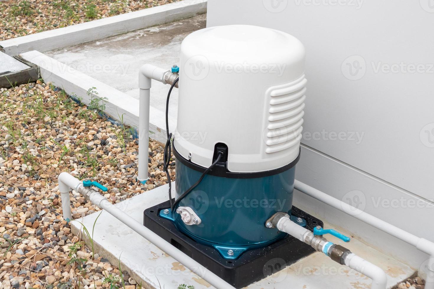 automatic water pump station outside the house photo