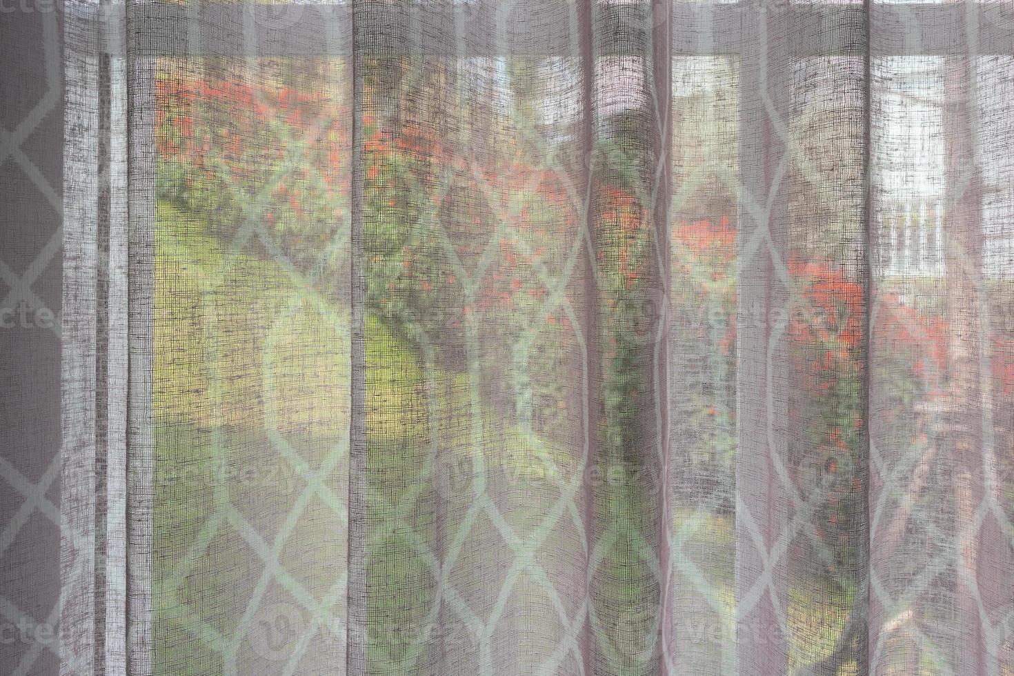 Abstract window curtain with flower garden closeup background photo