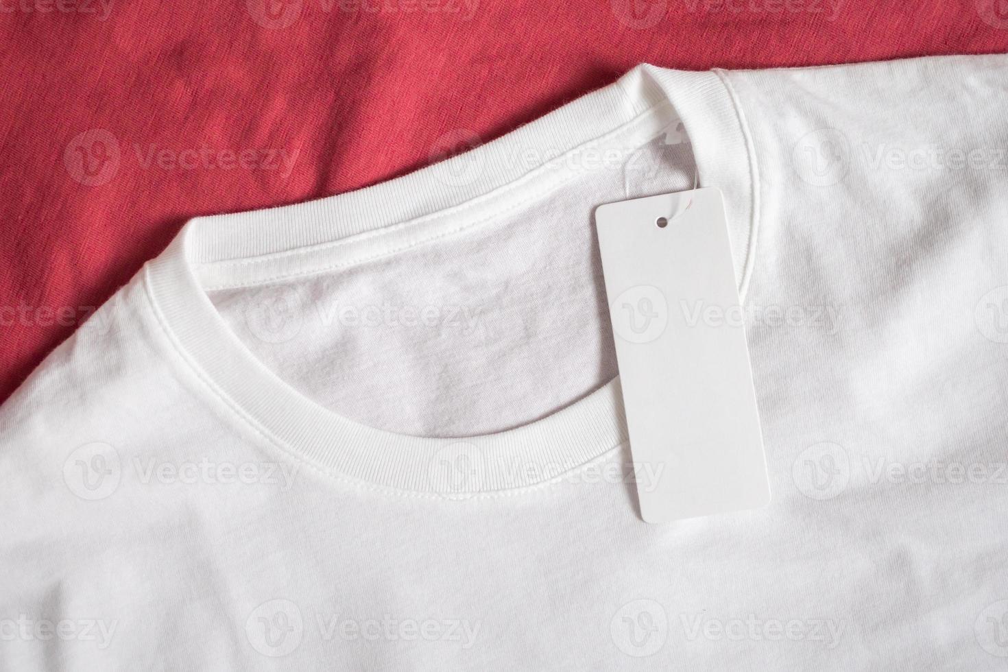 Blank price tag label on white t-shirt photo