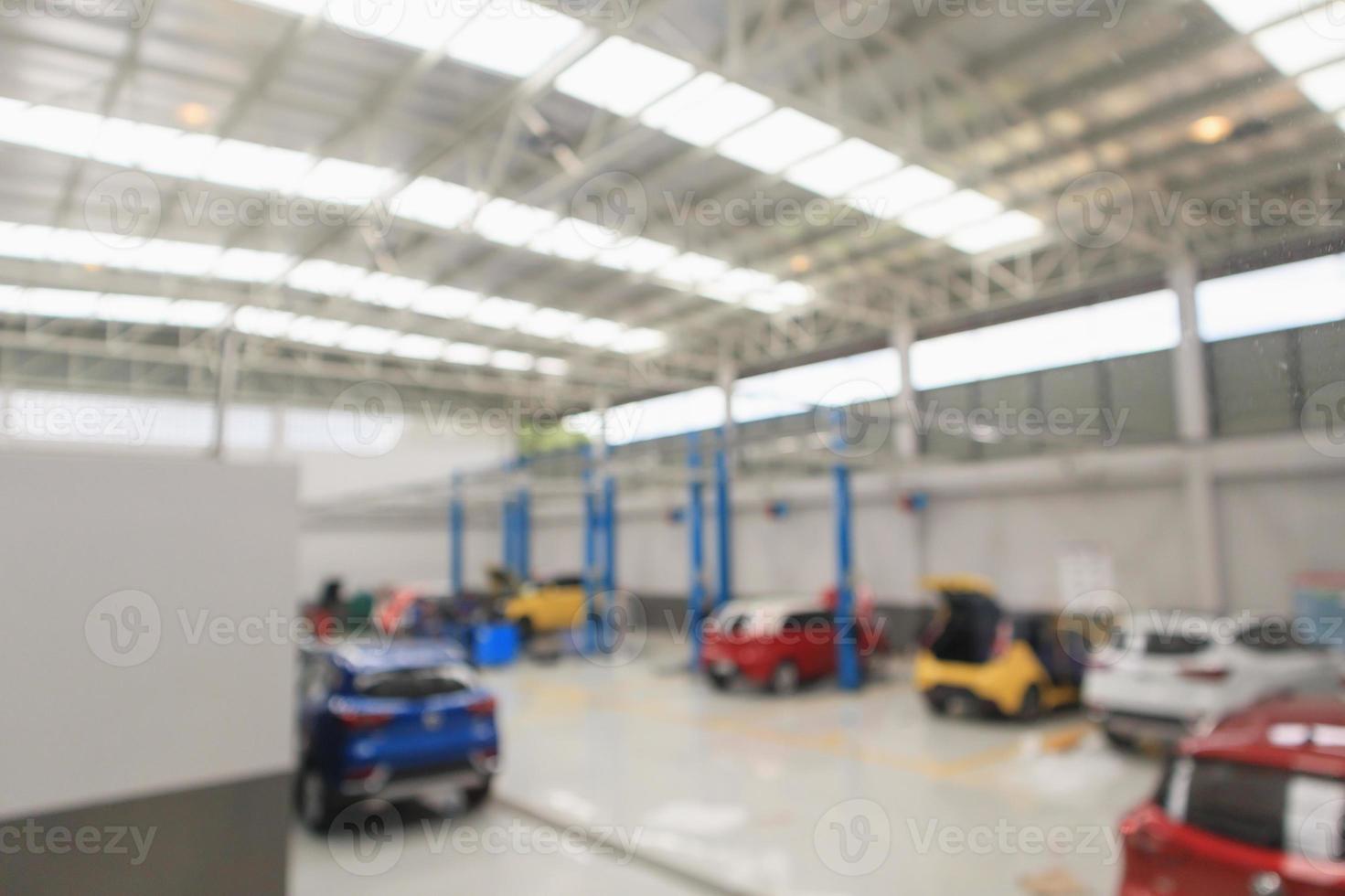 car service centre with auto at repair station bokeh light defocused blur background photo