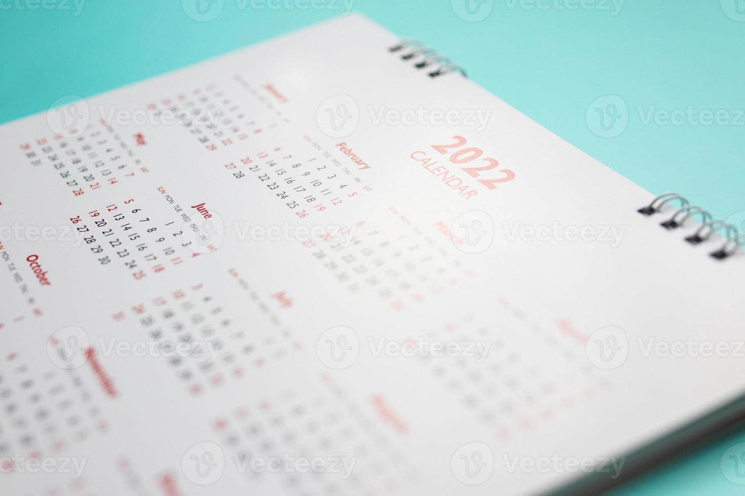 2022 calendar page on blue background business planning appointment meeting concept photo