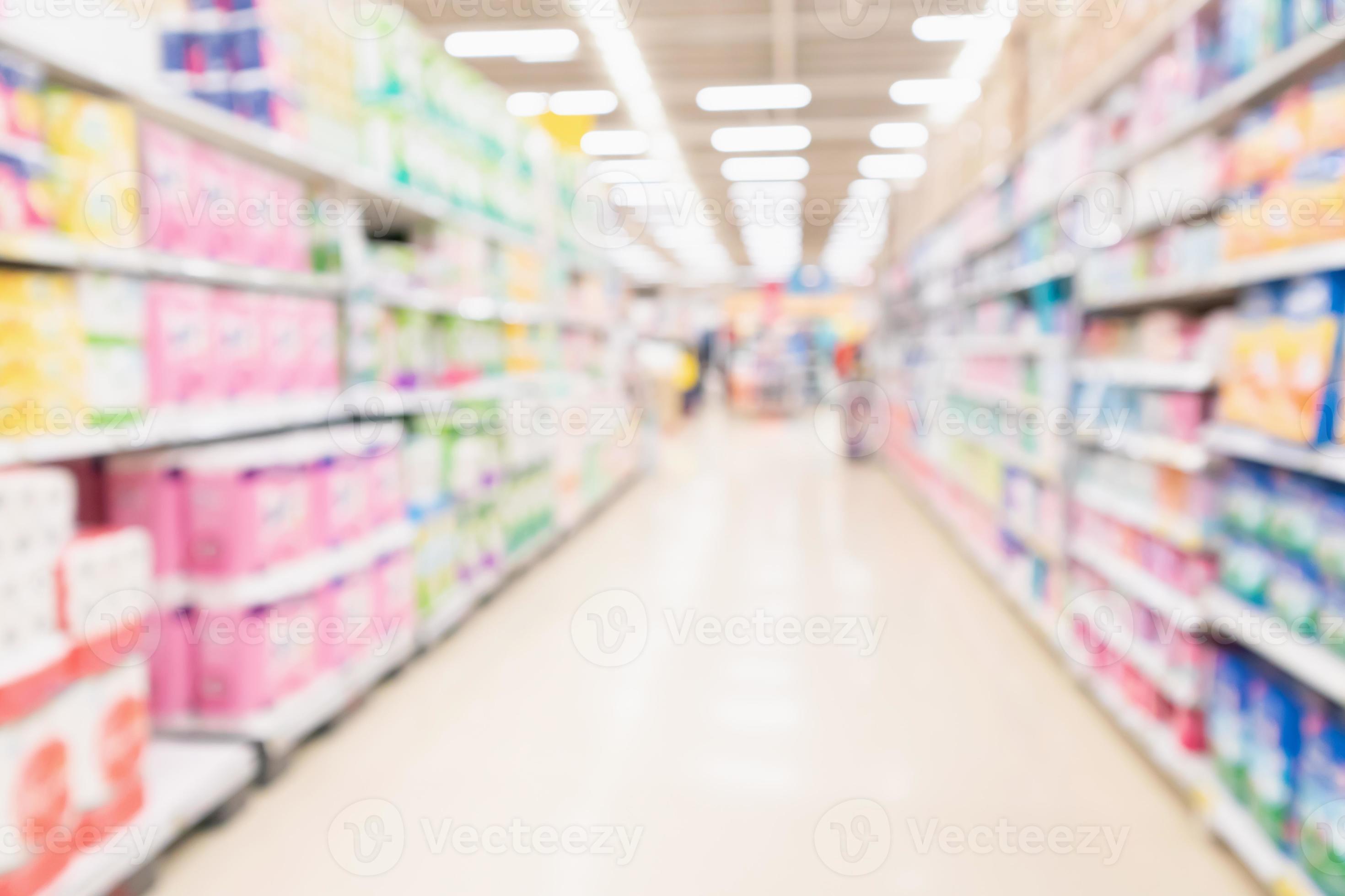 Abstract blurred supermarket aisle and shelves with various toilet