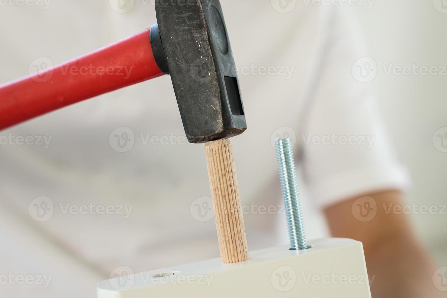 Man assembling furniture at home photo