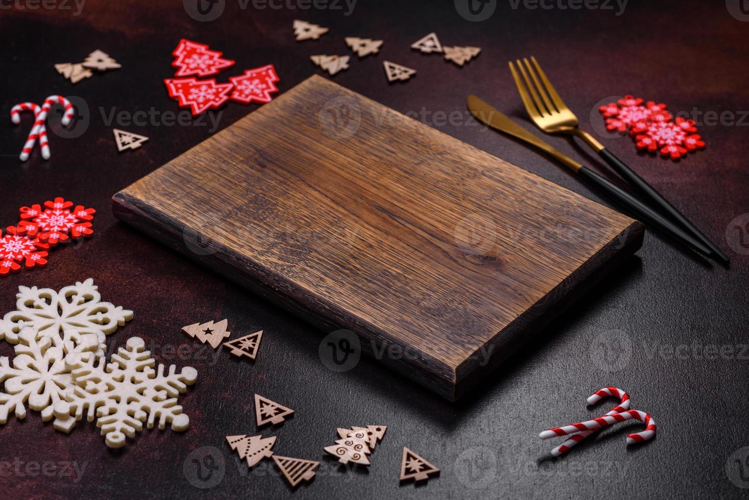 Christmas decoration elements as well as gingerbread on a brown concrete background photo