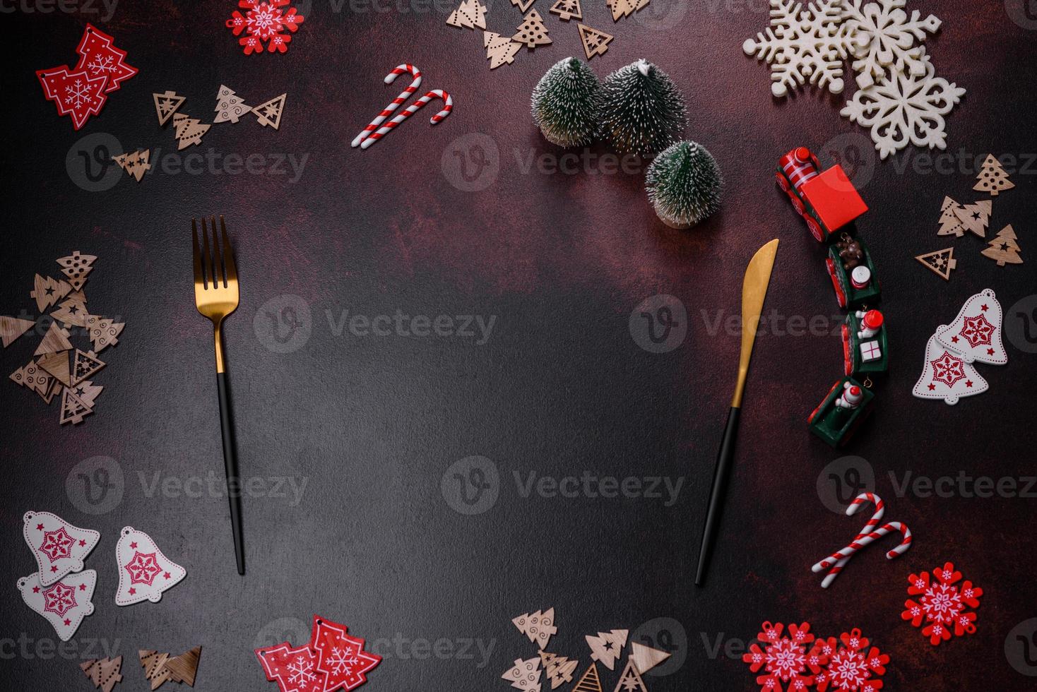 Christmas decoration elements as well as gingerbread on a brown concrete background photo