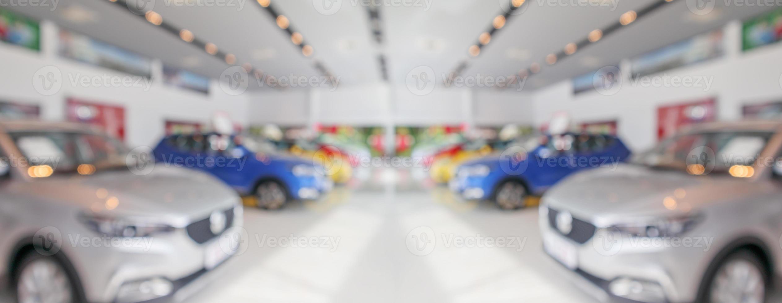 new cars in showroom interior blurred abstract background photo