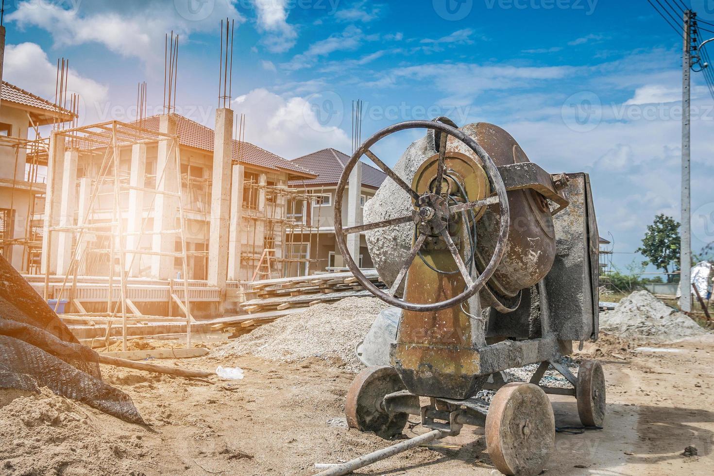 cement concrete mixer machine at new house building construction site photo