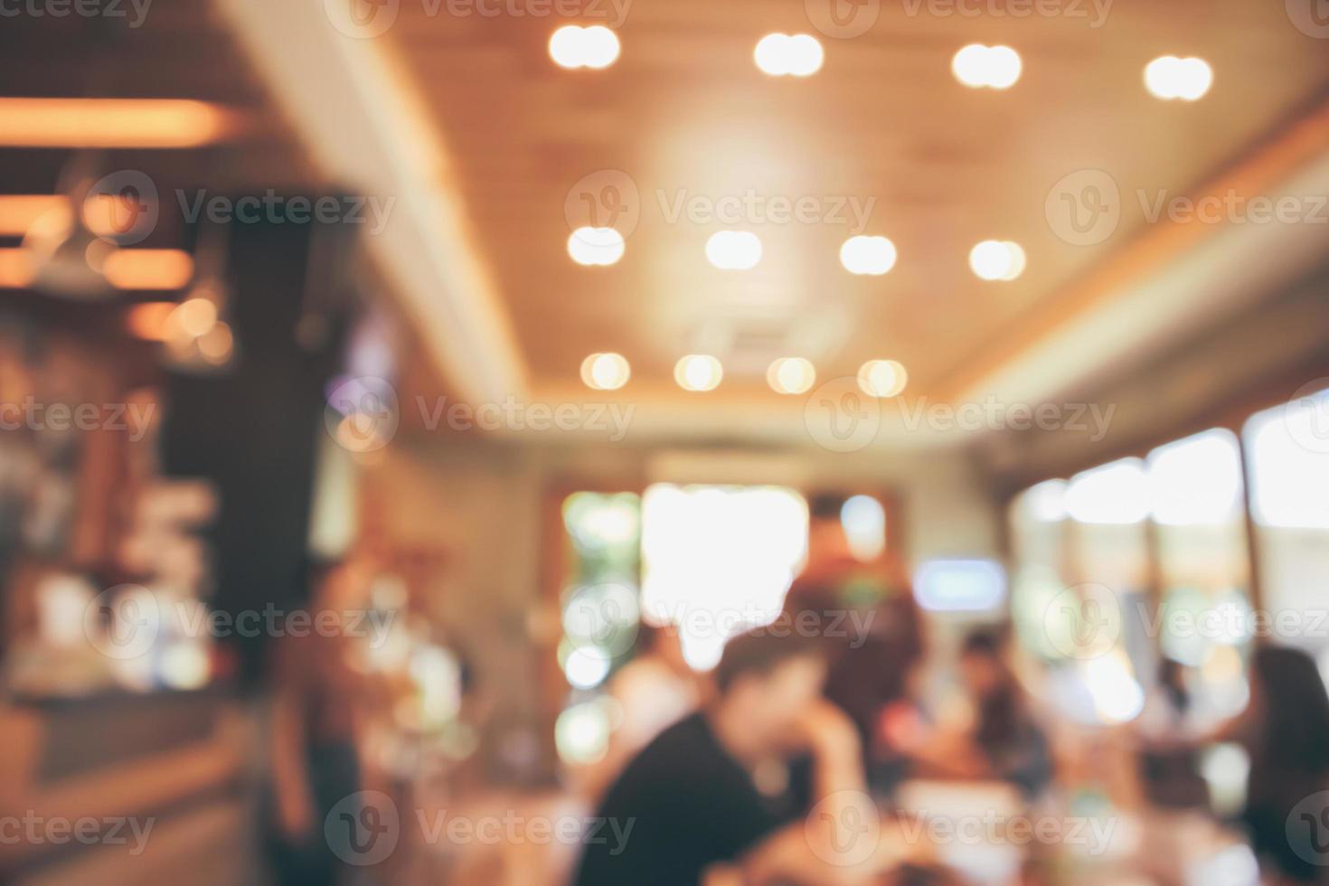 Restaurant cafe or coffee shop interior with customer blur abstract vintage style bokeh light for montage product display background photo