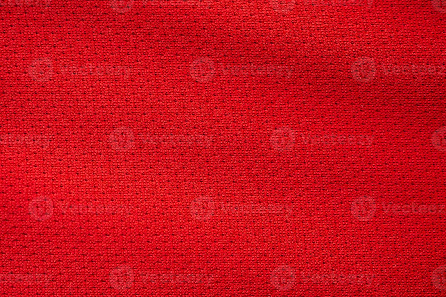 Red sports clothing fabric football jersey texture close up photo