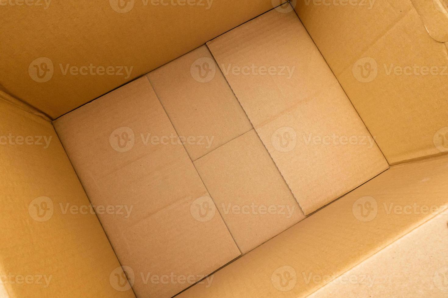 Open empty brown cardboard box background top view photo