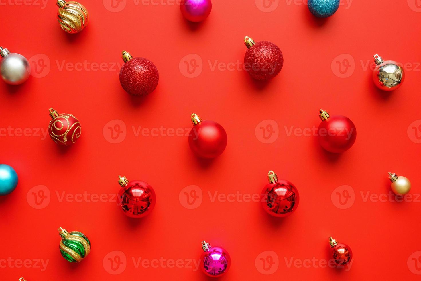 Christmas ball bauble pattern minimal flatlay on red background top view photo