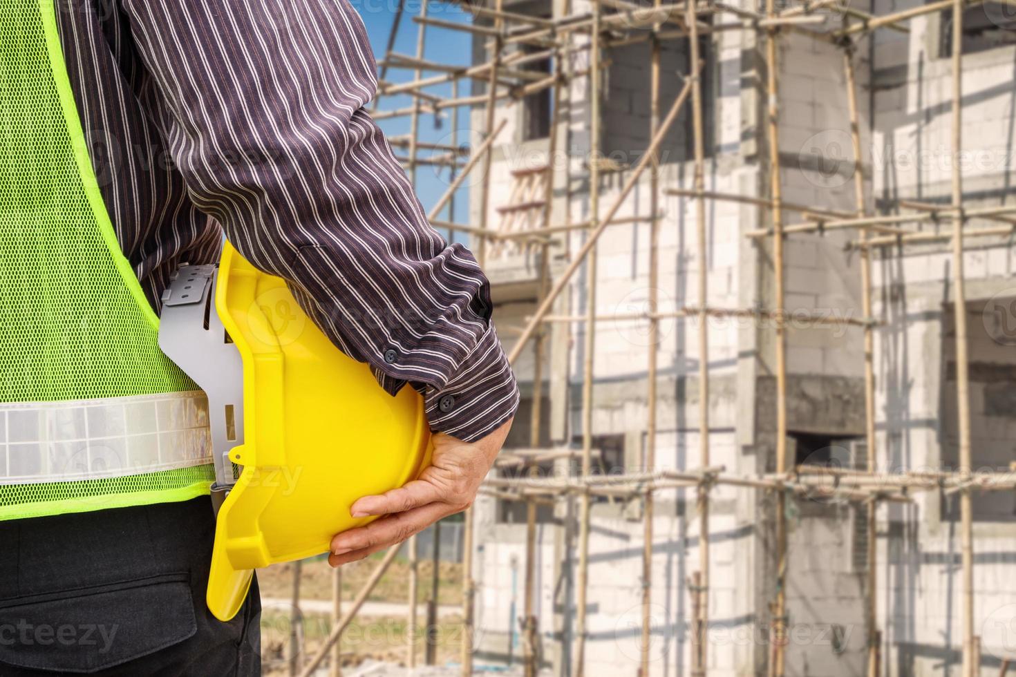 Asian business man construction engineer worker at house building site photo