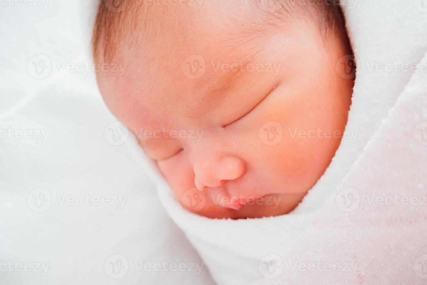 Newborn baby girl sleeping photo