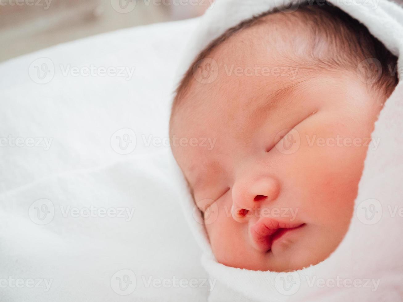 Newborn baby girl sleeping photo