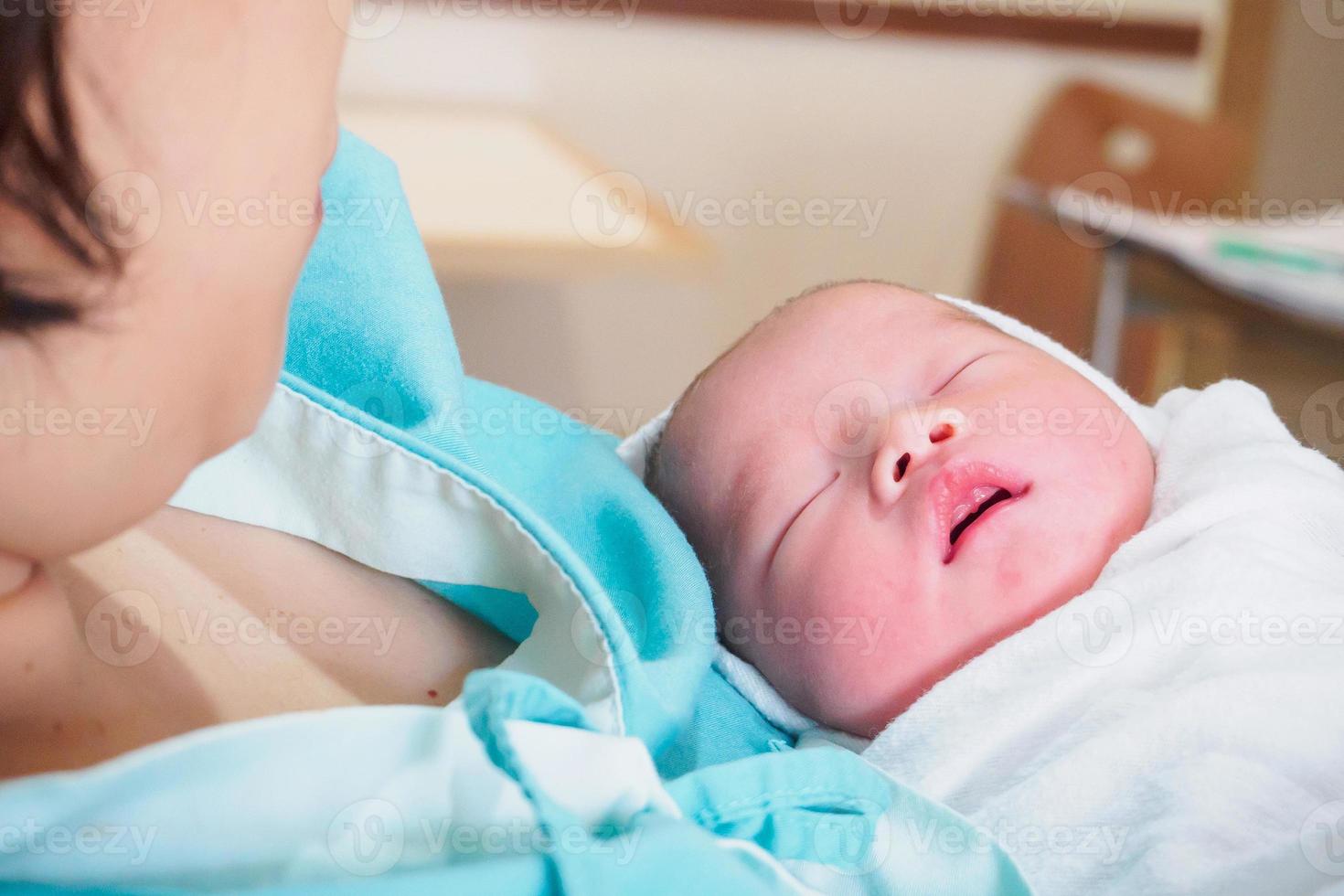 Happy Mother and Newborn Baby at the hospital photo