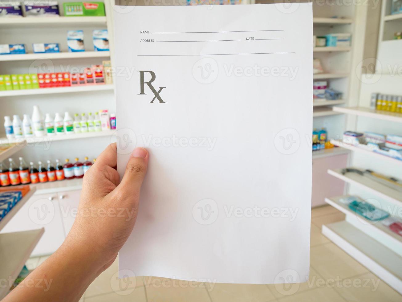 pharmacist with prescription at the pharmacy photo