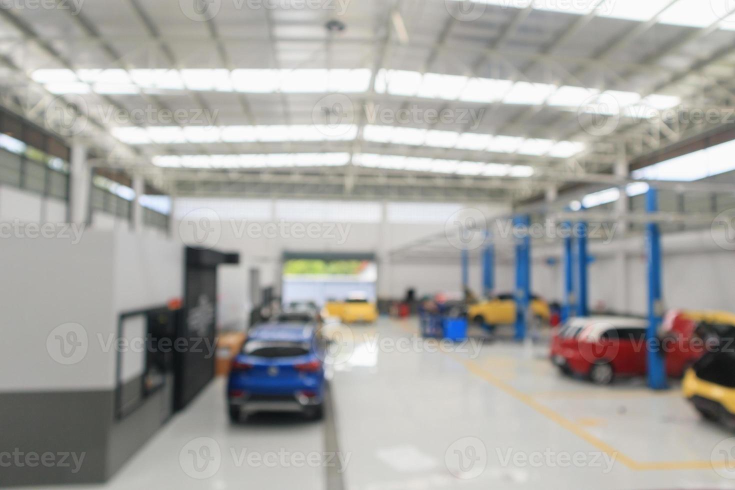 car service centre with auto at repair station bokeh light defocused blur background photo