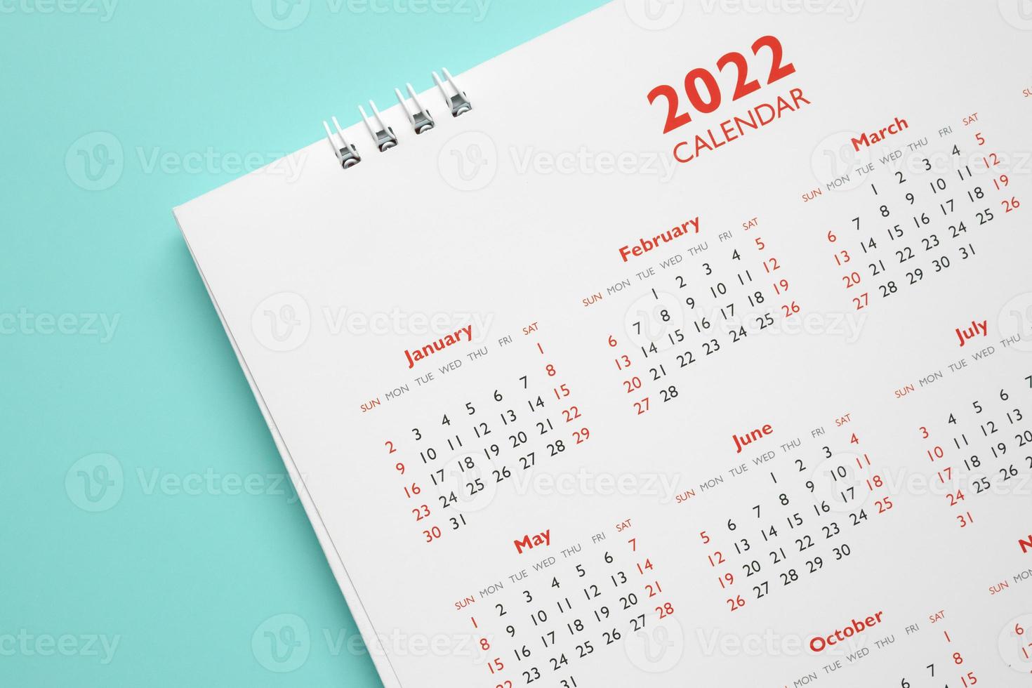 2022 calendar page on blue background business planning appointment meeting concept photo