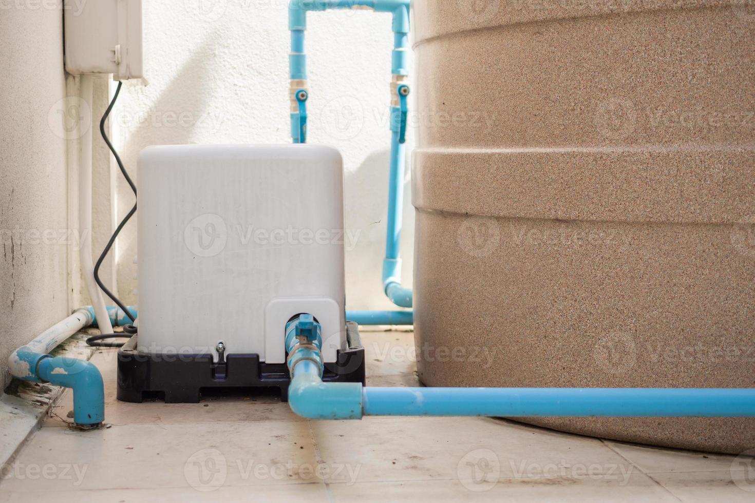 automatic water pump station outside the house photo