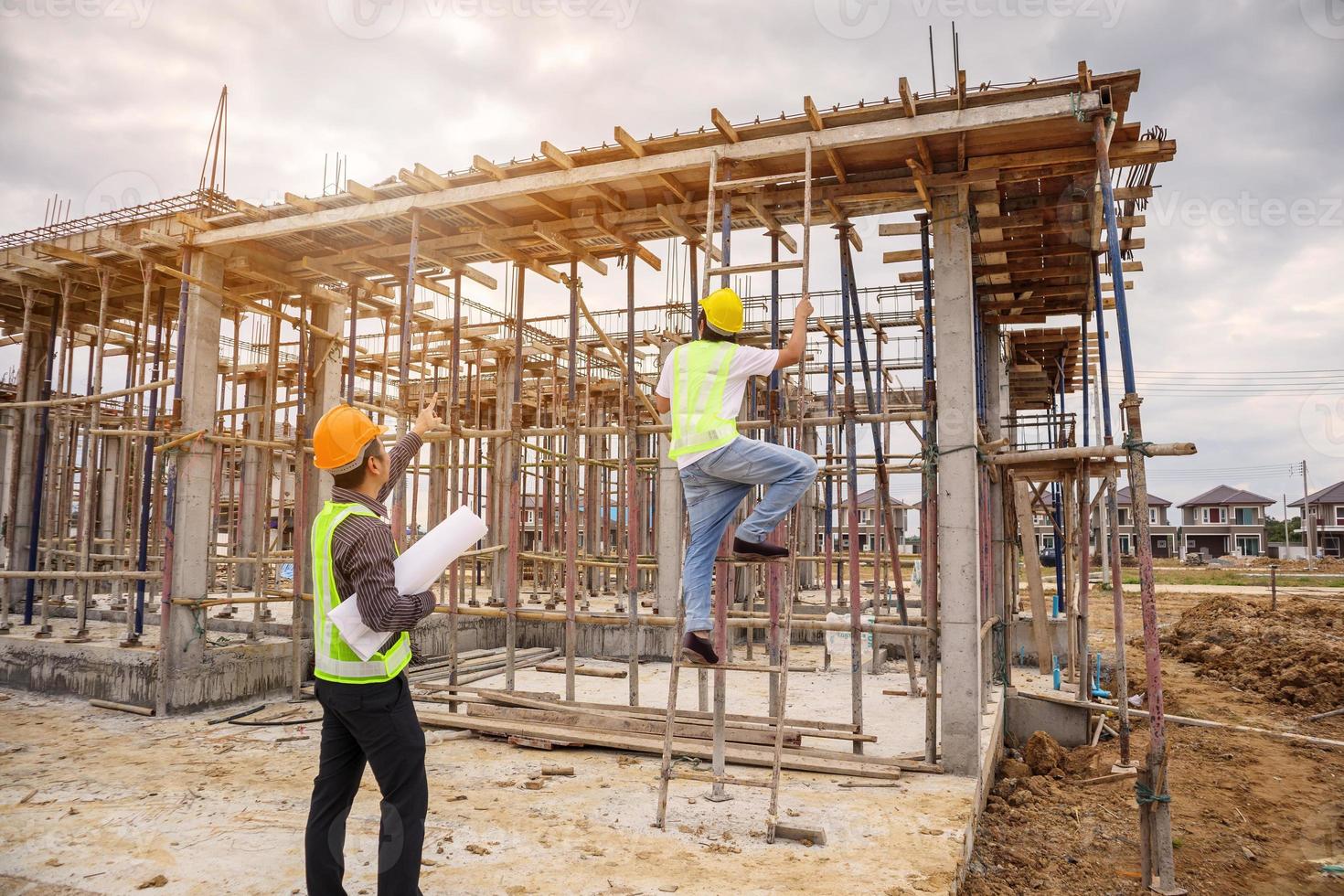 Asian business man construction engineer worker at building site photo