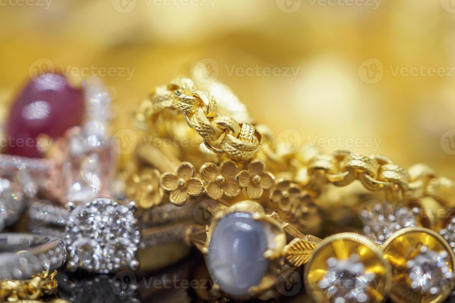 Luxury Jewelry diamond rings with reflection on black and golden background photo