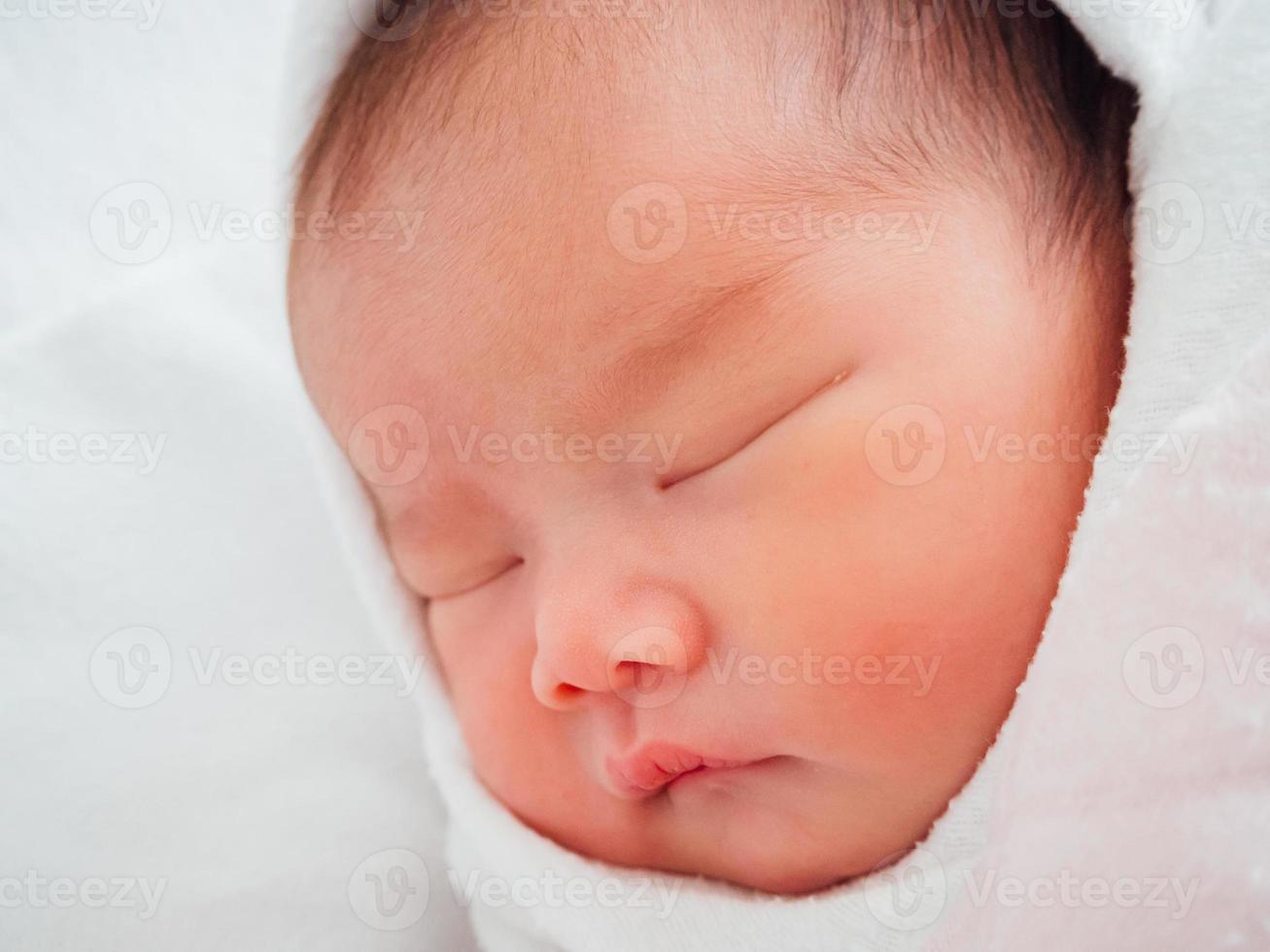 Newborn baby girl sleeping photo