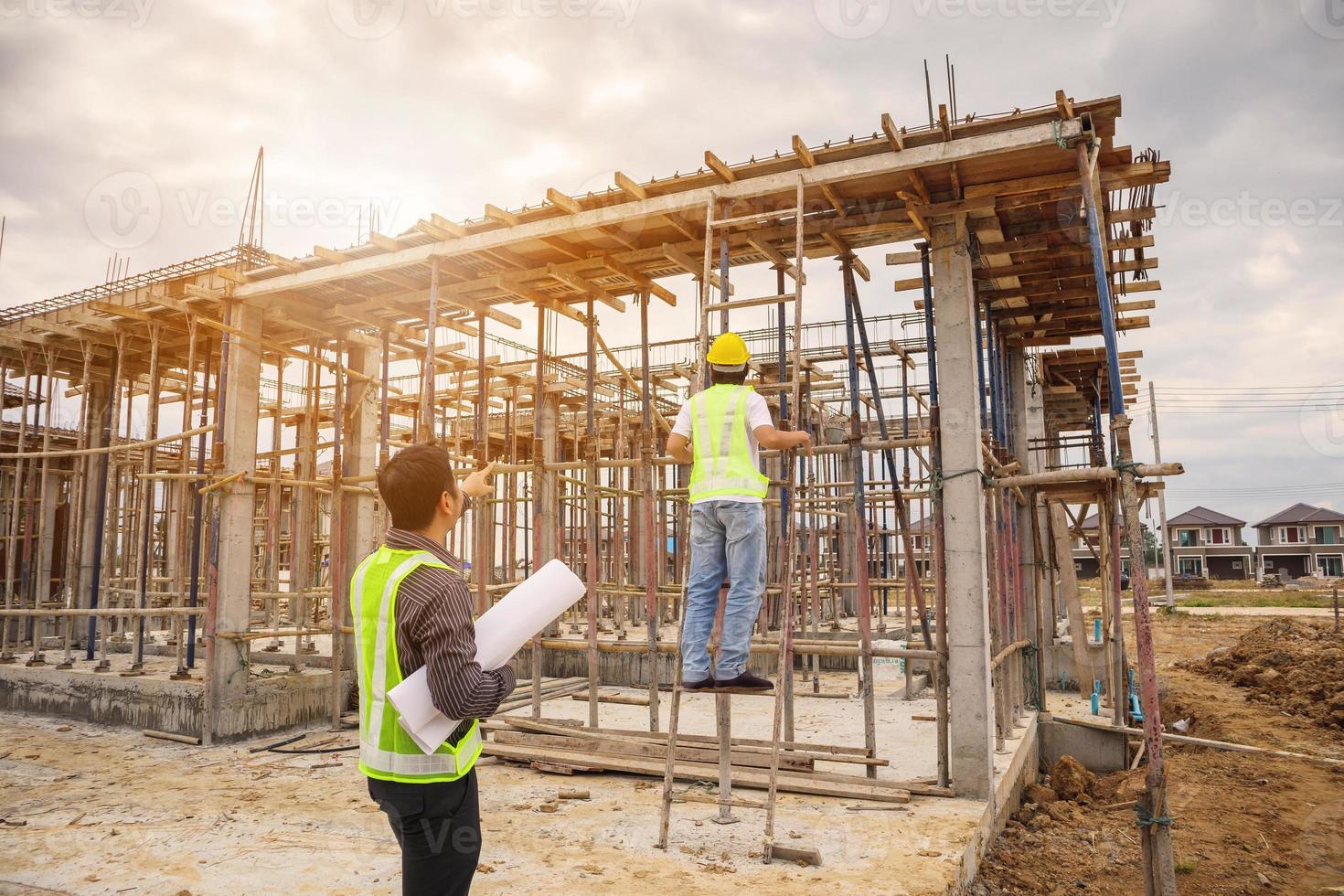 Asian business man construction engineer worker at building site photo