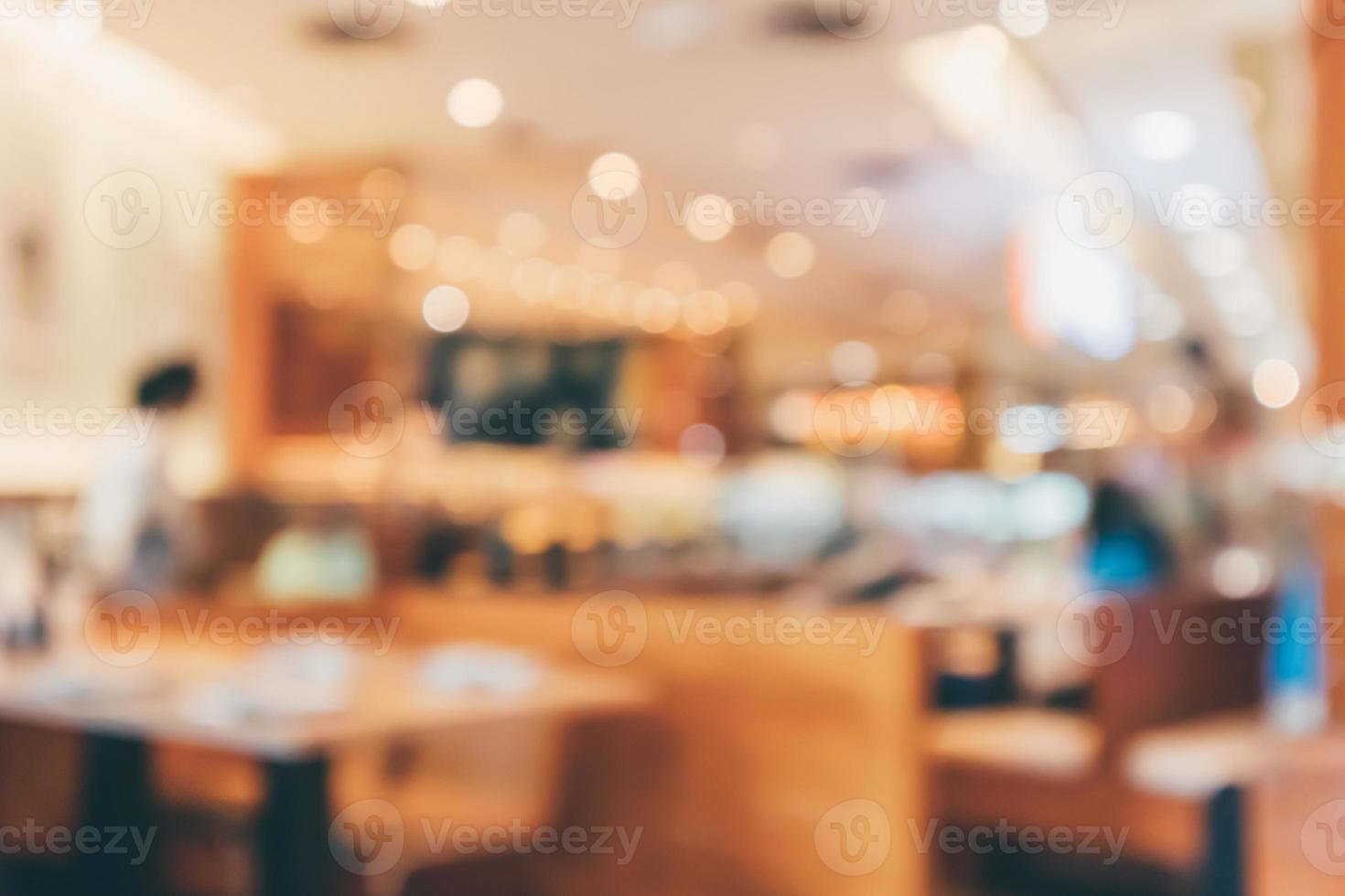 Cafe Restaurant interior with customer and wood table blur abstract background with bokeh light photo