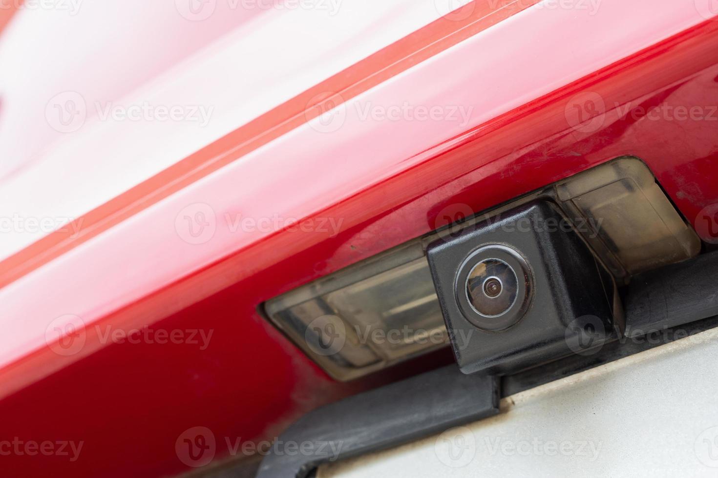 Red car rear view camera close up for parking assistance photo
