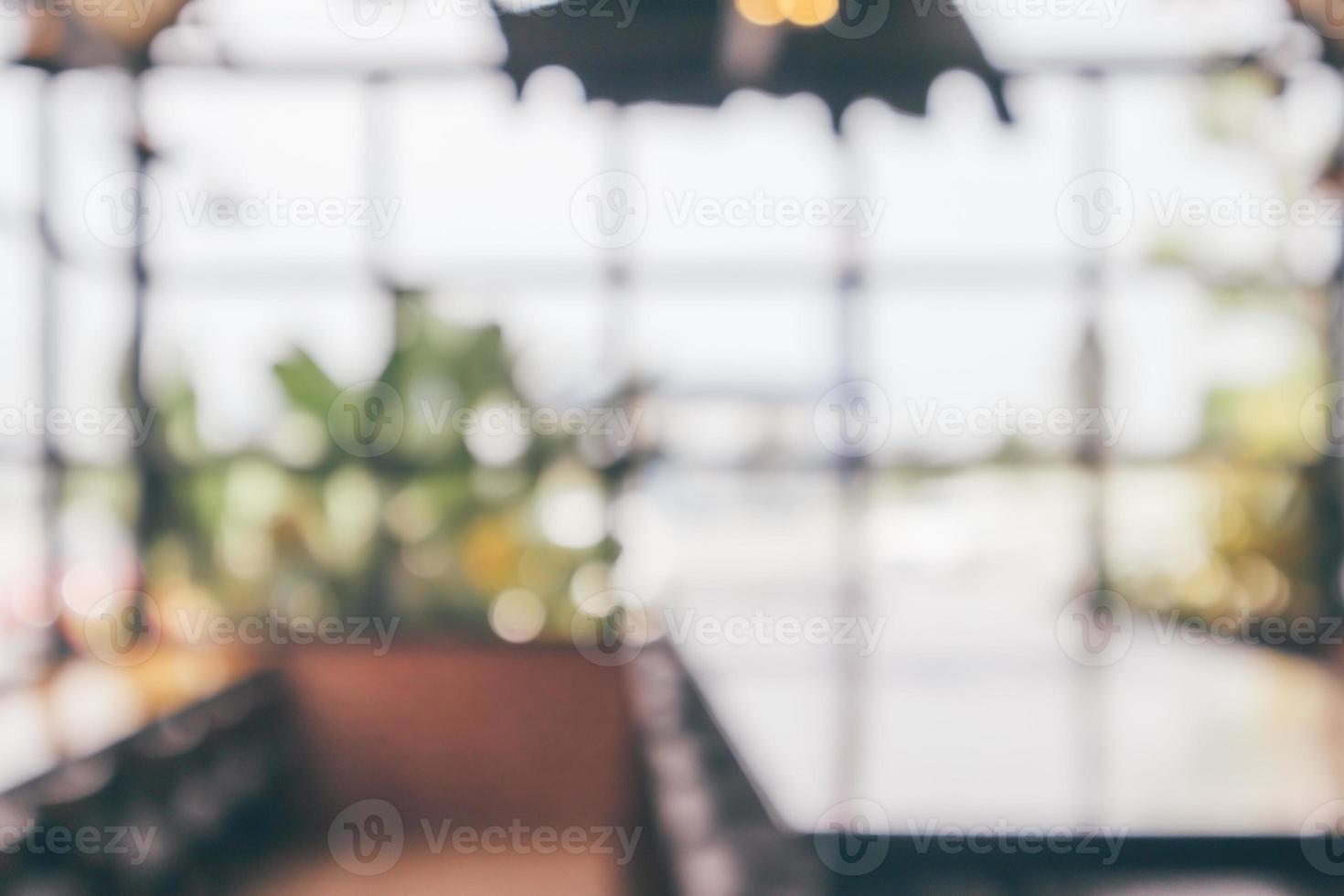 Cafe coffee shop interior abstract blur defocused with bokeh light background photo