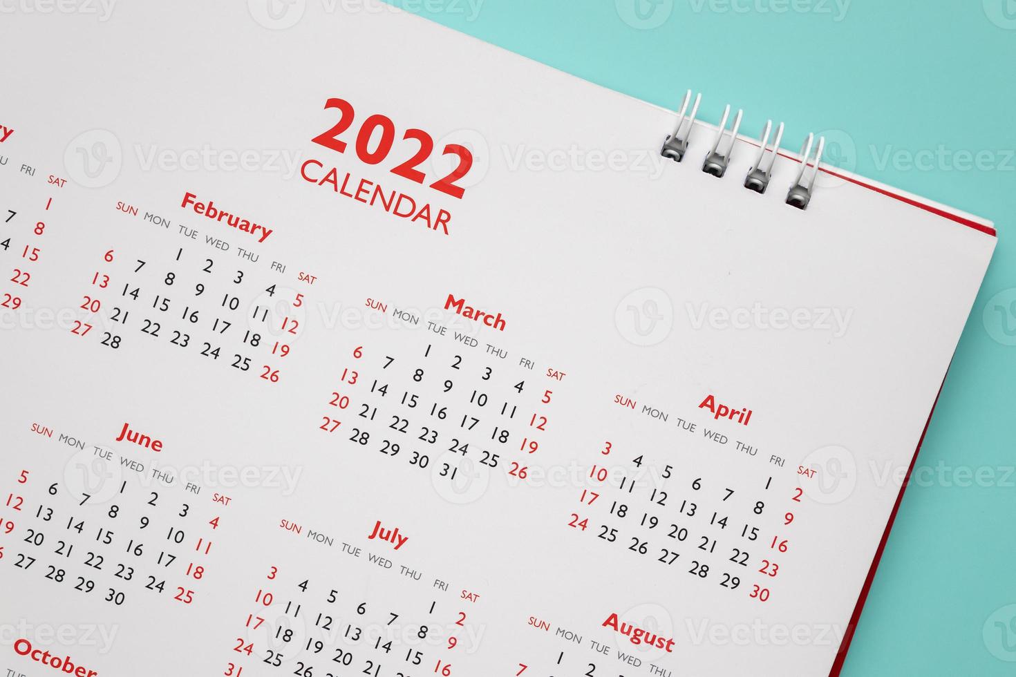 2022 calendar page on blue background business planning appointment meeting concept photo