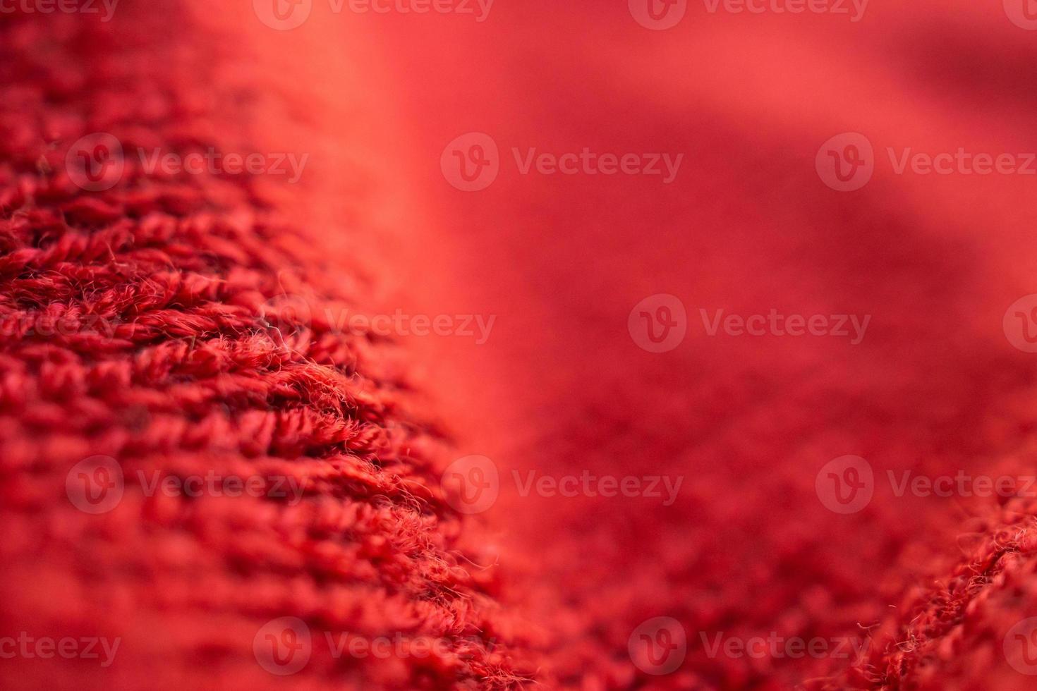 closeup red knitted woolen fabric texture background photo